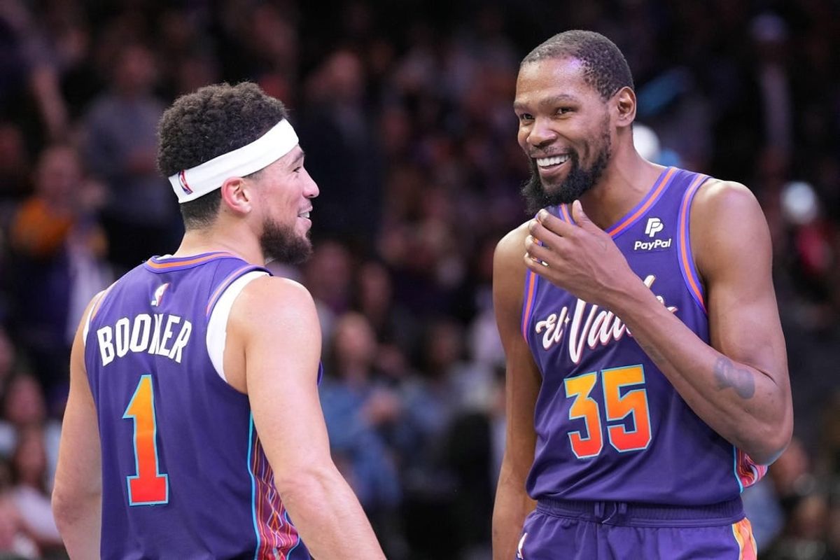 Nov 21, 2023; Phoenix, Arizona, USA; Phoenix Suns guard Devin Booker (1) and Phoenix Suns forward Kevin Durant (35) look on against the Portland Trail Blazers during the second half at Footprint Center.