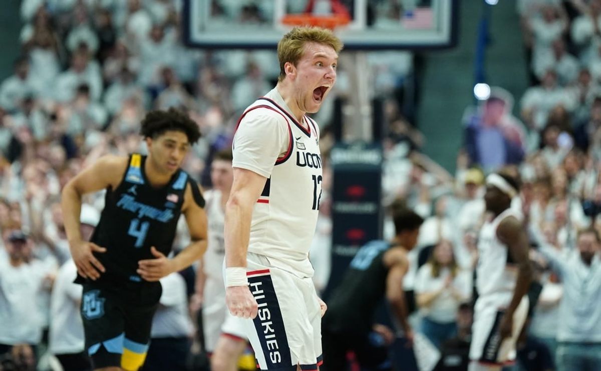 Feb 17, 2024; Hartford, Connecticut, USA; UConn Huskies guard Cam Spencer (12) reacts after a play against the Marquette Golden Eagles in the first half at XL Center.