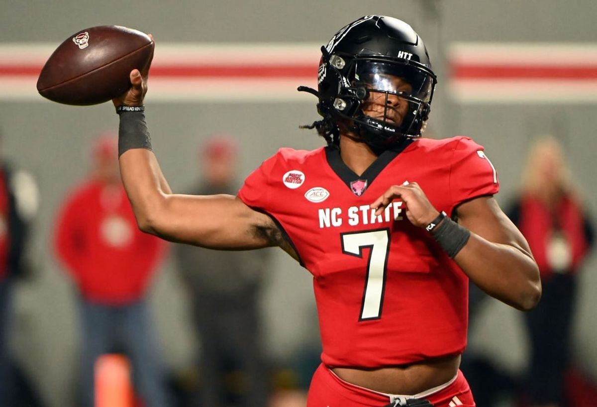 Nov 4, 2023; Raleigh, North Carolina, USA; North Carolina State Wolfpack quarterback MJ Morris (7) throws a pass during the first half against the Miami Hurricanes at Carter-Finley Stadium.