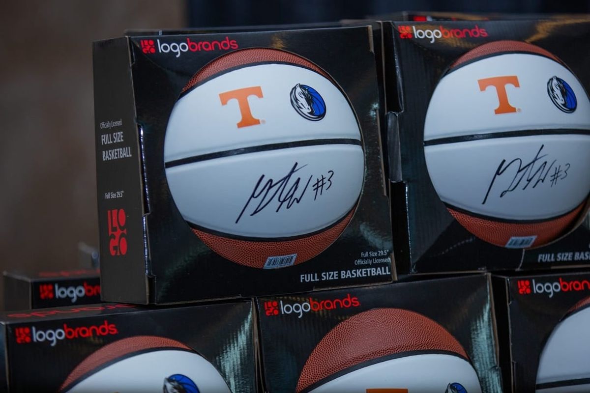 A young boy with a Grant Williams autographed basketball at the Greater Knoxville Sports Hall of Fame induction banquet held at the Knoxville Convention Center on Thursday, Aug. 21, 2023.