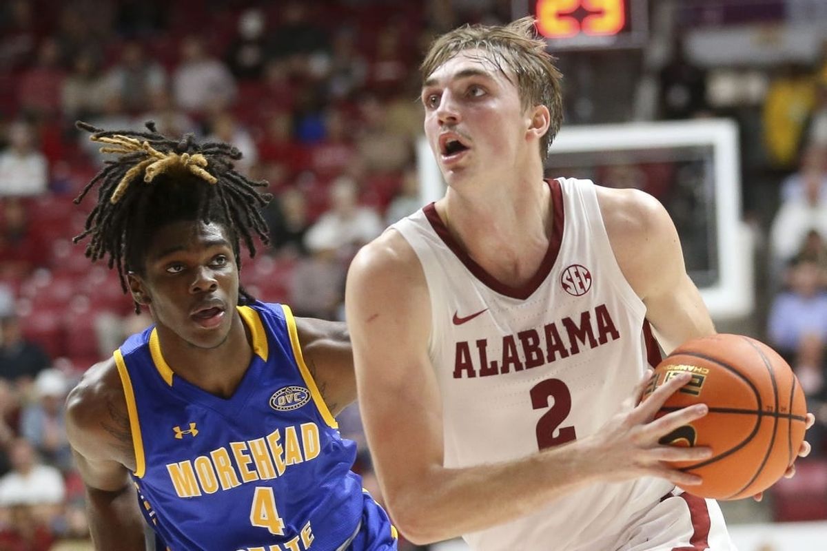Nov 6, 2023; Tuscaloosa, Alabama, USA; Alabama forward Grant Nelson (2) drives past Morehead State guard Eddie Ricks (4) on his way to the hoop in the game at Coleman Coliseum.