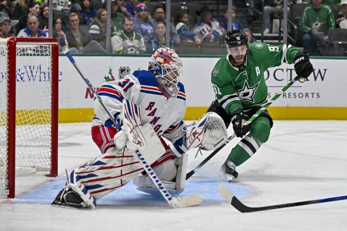 Nov 20, 2023; Dallas, Texas, USA; Dallas Stars center Tyler Seguin (91) calls for the puck in front of New York Rangers goaltender Igor Shesterkin (31) during the second period at the American Airlines Center.