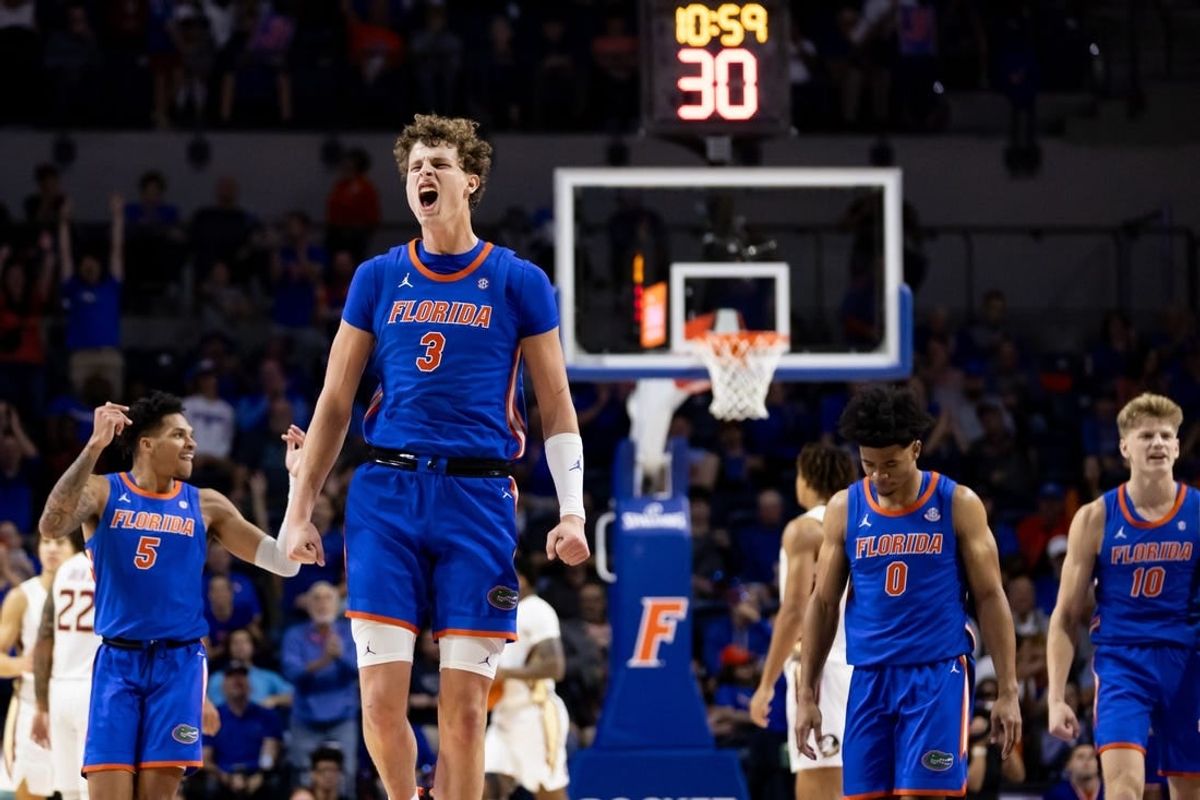 Nov 17, 2023; Gainesville, Florida, USA; Florida Gators center Micah Handlogten (3) celebrates during a timeout during the first half against the Florida State Seminoles at Exactech Arena at the Stephen C. O'Connell Center.