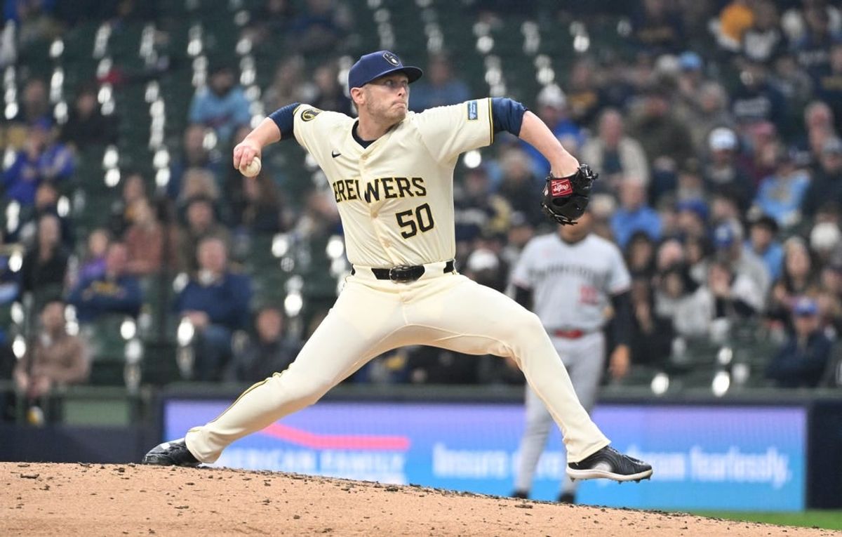 Apr 3, 2024; Milwaukee, Wisconsin, USA; Milwaukee Brewers relief pitcher J.B. Bukauskas delivers a pitch against the Minnesota Twins in the fifth inning at American Family Field.