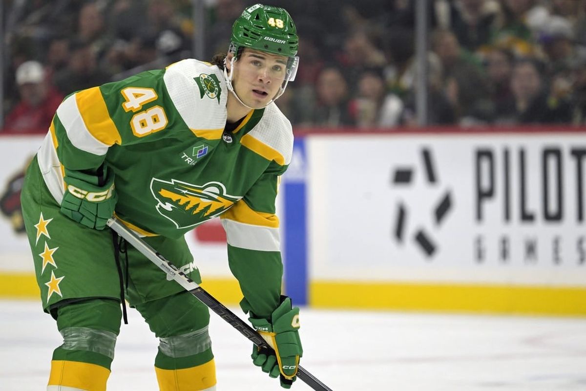 Dec 16, 2023; Saint Paul, Minnesota, USA;  Minnesota Wild defenseman Daemon Hunt (48) gets into position against the Vancouver Canucks during the first period at Xcel Energy Center.
