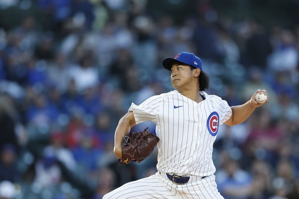 May 7, 2024; Chicago, Illinois, USA; Chicago Cubs starting pitcher Shota Imanaga (18) delivers a pitch against the San Diego Padres during the second inning at Wrigley Field.