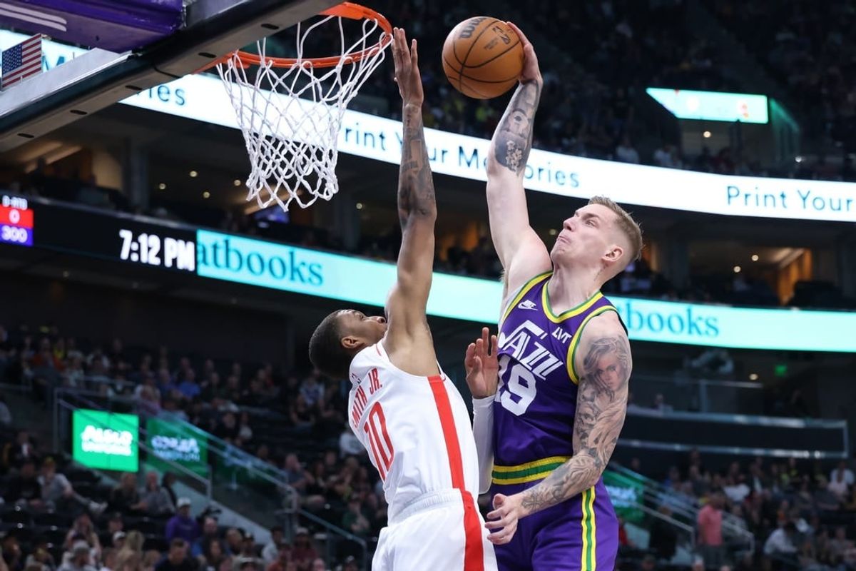 Apr 11, 2024; Salt Lake City, Utah, USA; Utah Jazz forward Luka Samanic (19) attempts a dunk against Houston Rockets forward Jabari Smith Jr. (10) during the first quarter at Delta Center.