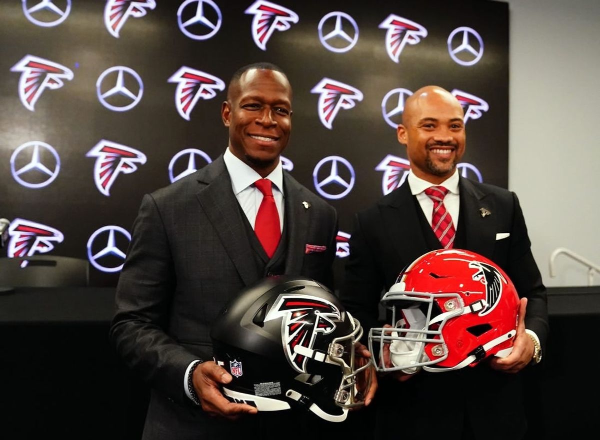 Feb 5, 2024; Atlanta, GA, USA; Atlanta Falcons head coach Raheem Morris and general manager Terry Fontenot pose for the media after Morris was introduced as the head coach of the Atlanta Falcons at Mercedes-Benz Stadium.