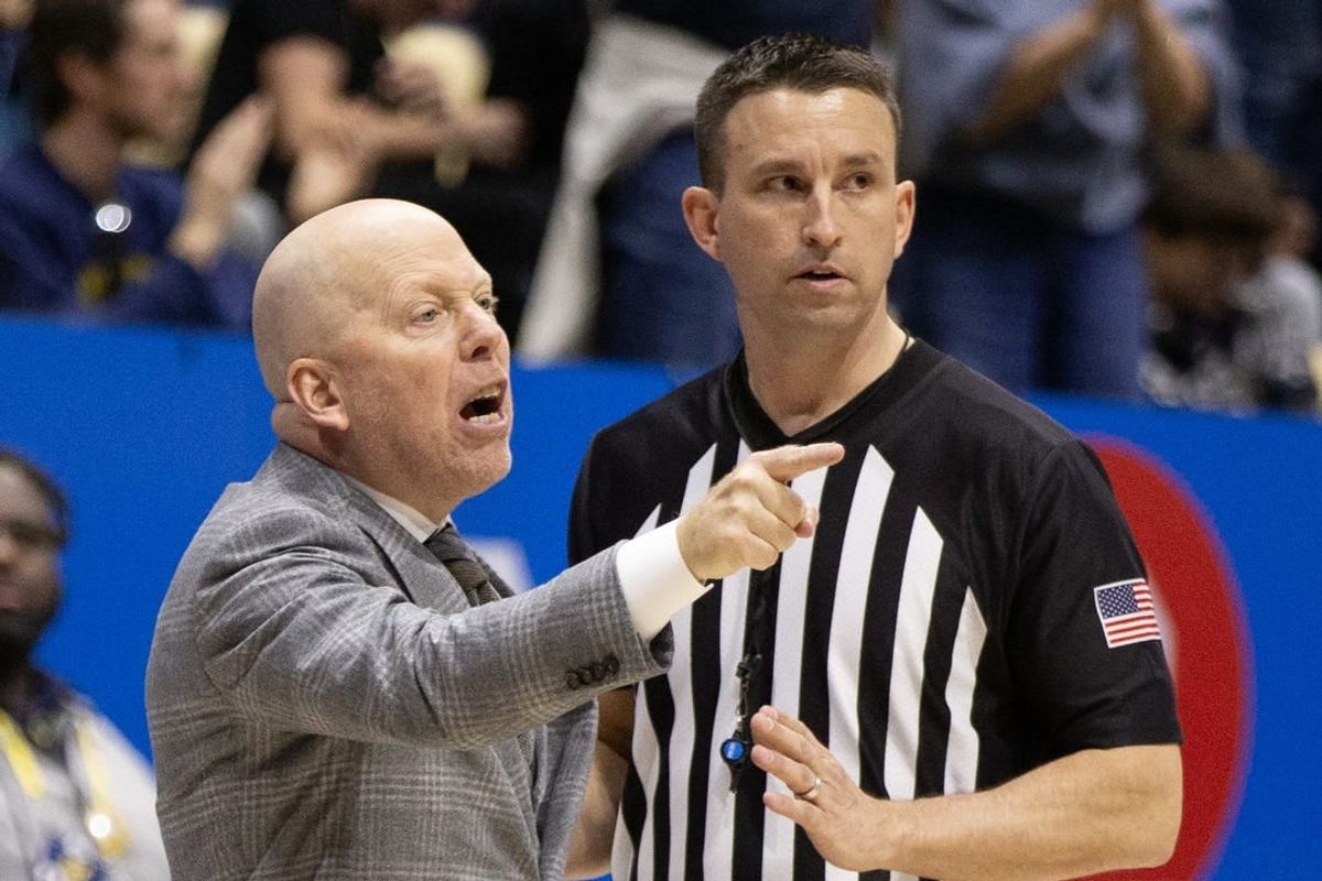 Feb 10, 2024; Berkeley, California, USA; UCLA Bruins head coach Mick Cronin (left) argues a call with a referee during the second half against the California Golden Bears at Haas Pavilion.
