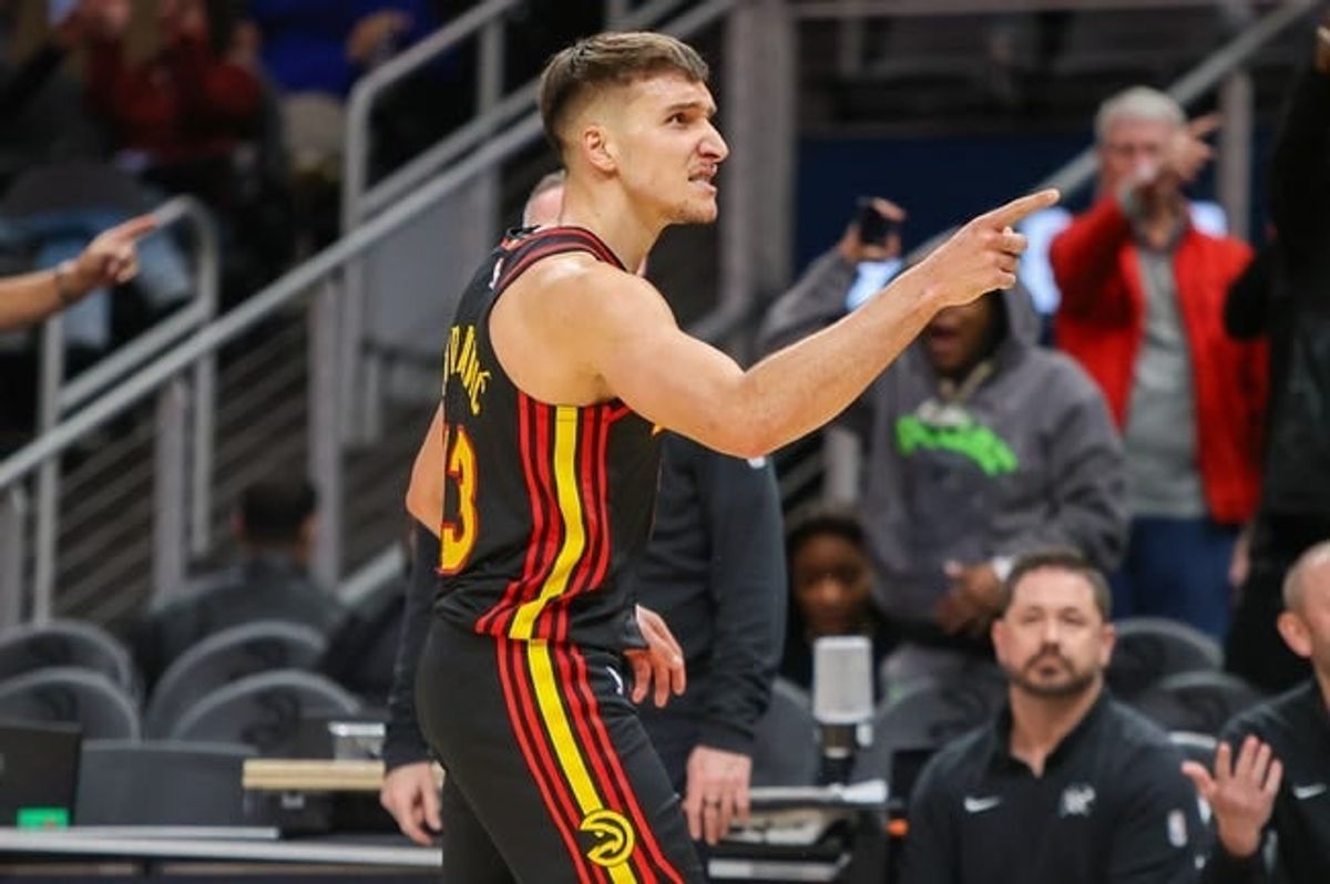 Dec 11, 2023; Atlanta, Georgia, USA; Atlanta Hawks guard Bogdan Bogdanovic (13) reacts after a basket against the Denver Nuggets in the second half at State Farm Arena.