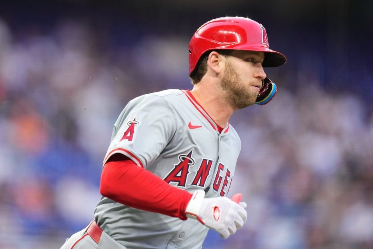 Apr 1, 2024; Miami, Florida, USA; Los Angeles Angels left fielder Taylor Ward (3) rounds first base after hitting a double against the Miami Marlins during the second inning at loanDepot Park.