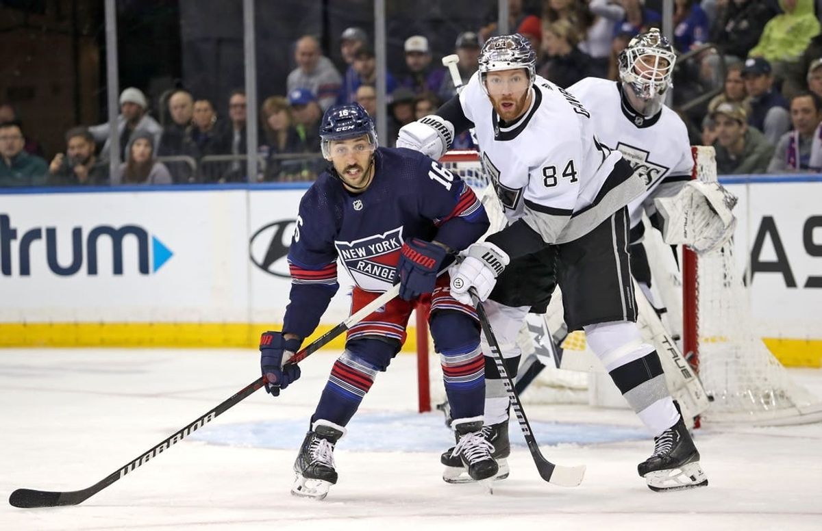 Dec 10, 2023; New York, New York, USA; New York Rangers center Vincent Trocheck (16) and Los Angeles Kings defenseman Vladislav Gavrikov (84) battle for position in front of Los Angeles Kings goalie Pheonix Copley (29) during the first period at Madison Square Garden.