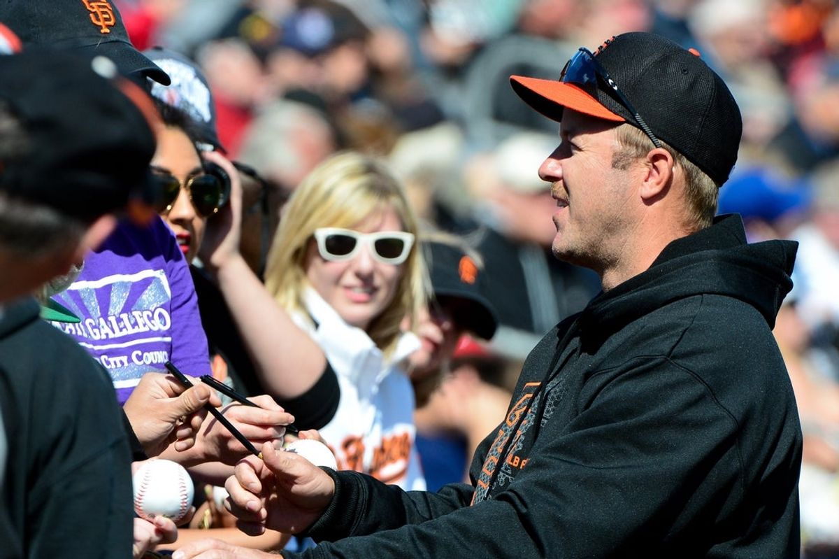 Feb. 24, 2013; Mesa, AZ, USA; San Francisco Giants former player Jeff Kent signs autographs for fans prior to the game against the Chicago Cubs at Hohokam Park. The Cubs won 4-3.  Mandatory Credit: Matt Kartozian-Imagn Images