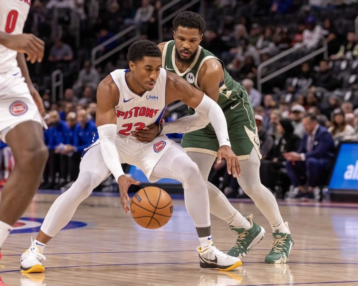 Jan 22, 2024; Detroit, Michigan, USA; Detroit Pistons guard Jaden Ivey (23) protects the ball from Milwaukee Bucks guard Malik Beasley (5) during the first quarter at Little Caesars Arena.