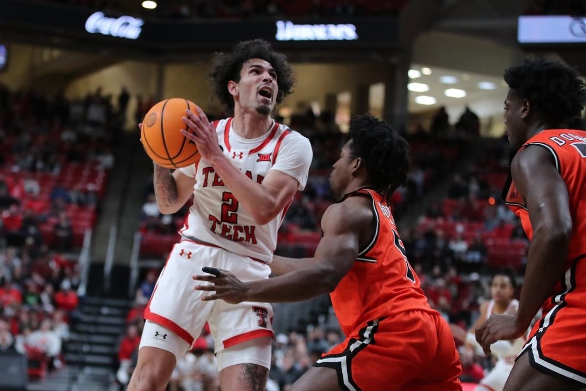 Dec 28, 2023; Lubbock, Texas, USA; Texas Tech Red Raiders guard Pop Isaacs (2) shoots over Sam Houston Bearkats guard Marcus Boykin (5) in the first half at United Supermarkets Arena.