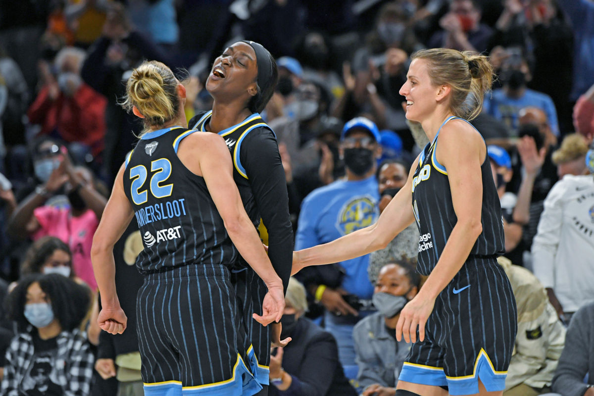 Chicago Sky’s Kahleah Copper, back left, celebrates with Allie Quigley, right, and Courtney Vandersloot (22) after making a shot and drawing a foul during the first half of Game 3 of the WNBA Finals against the Phoenix Mercury on Friday.