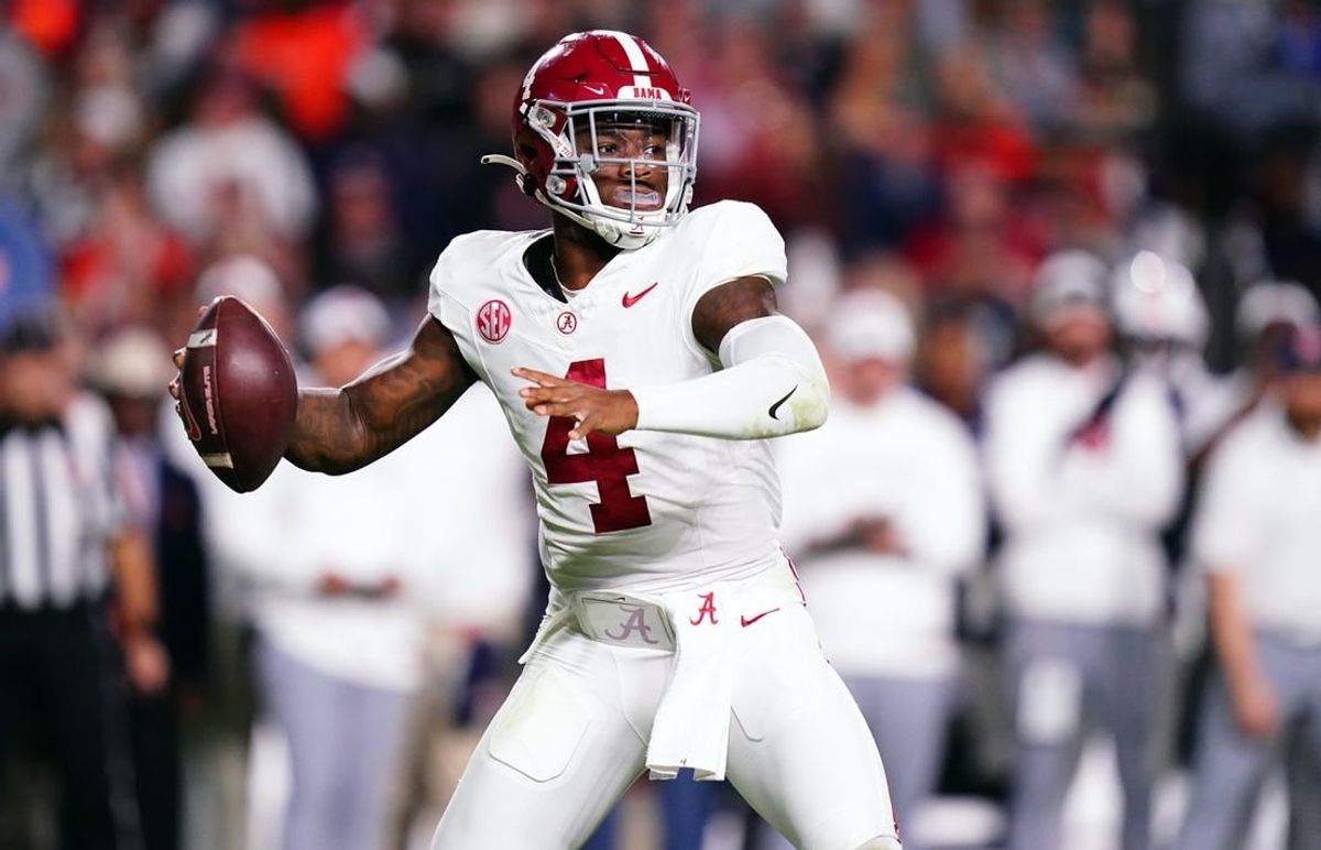 Nov 25, 2023; Auburn, Alabama, USA; Alabama Crimson Tide quarterback Jalen Milroe (4) drops back to pass against the Auburn Tigers during the fourth quarter at Jordan-Hare Stadium.