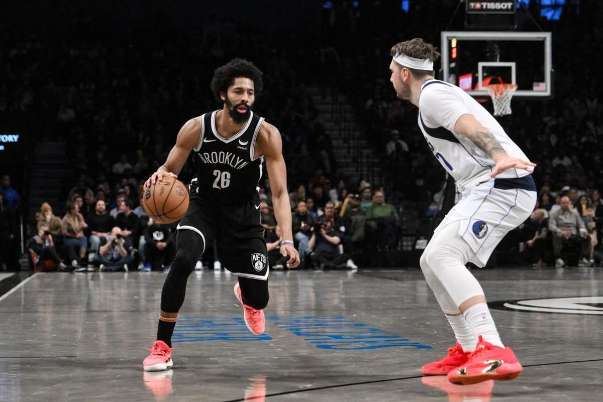 Feb 6, 2024; Brooklyn, New York, USA; Brooklyn Nets guard Spencer Dinwiddie (26) makes a move against Dallas Mavericks guard Luka Doncic (77) during the fourth quarter at Barclays Center.