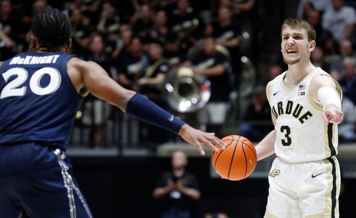 Xavier Musketeers guard Dayvion McKnight (20) defends Purdue Boilermakers guard Braden Smith (3) during the NCAA men   s basketball game, Monday, Nov. 13, 2023, at Mackey Arena in West Lafayette, Ind. Purdue Boilermakers won 83-71.
