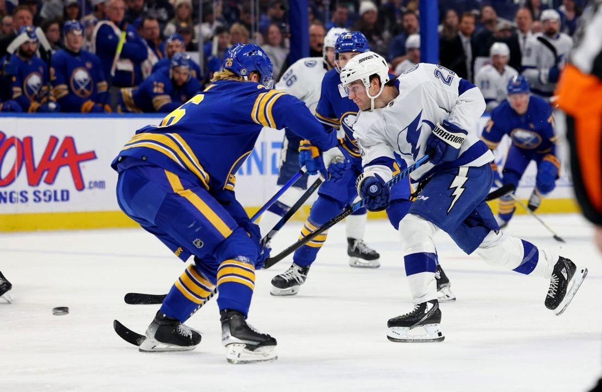 Jan 20, 2024; Buffalo, New York, USA;  Buffalo Sabres defenseman Rasmus Dahlin (26) looks to block a shot by Tampa Bay Lightning center Brayden Point (21) during the first period at KeyBank Center.