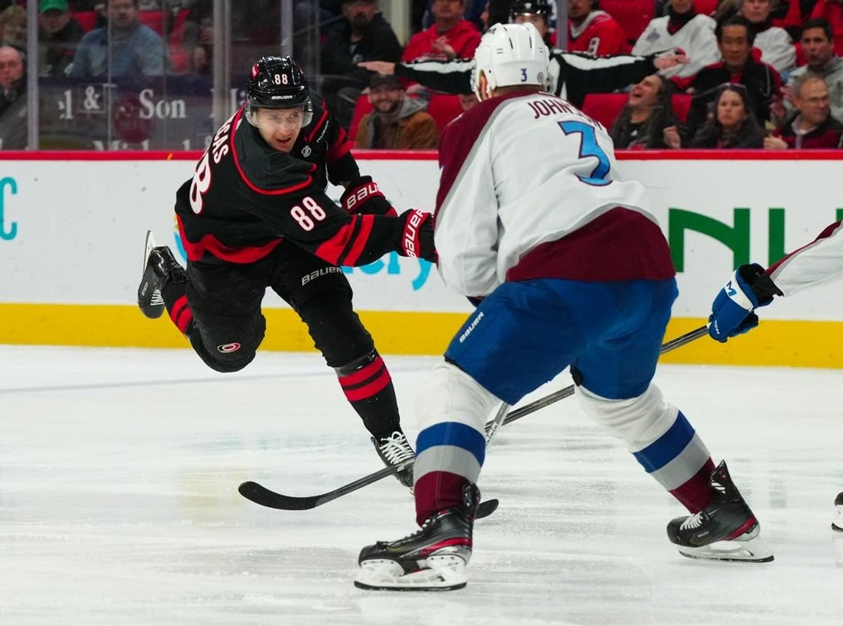Feb 8, 2024; Raleigh, North Carolina, USA; Carolina Hurricanes center Martin Necas (88) scores a goal against the Colorado Avalanche during the first period at PNC Arena.