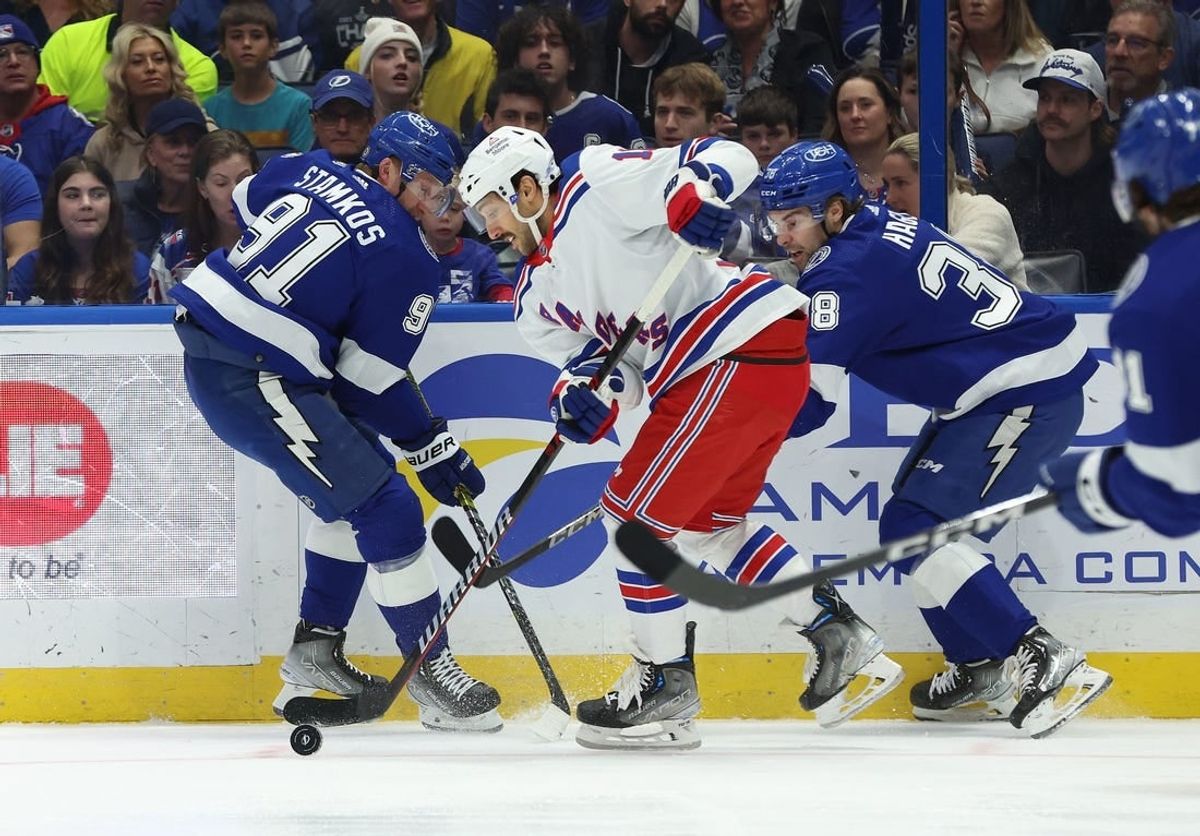 Dec 30, 2023; Tampa, Florida, USA;New York Rangers center Vincent Trocheck (16) skate with the puck as Tampa Bay Lightning center Steven Stamkos (91) and Tampa Bay Lightning left wing Brandon Hagel (38) defend during the first period at Amalie Arena.