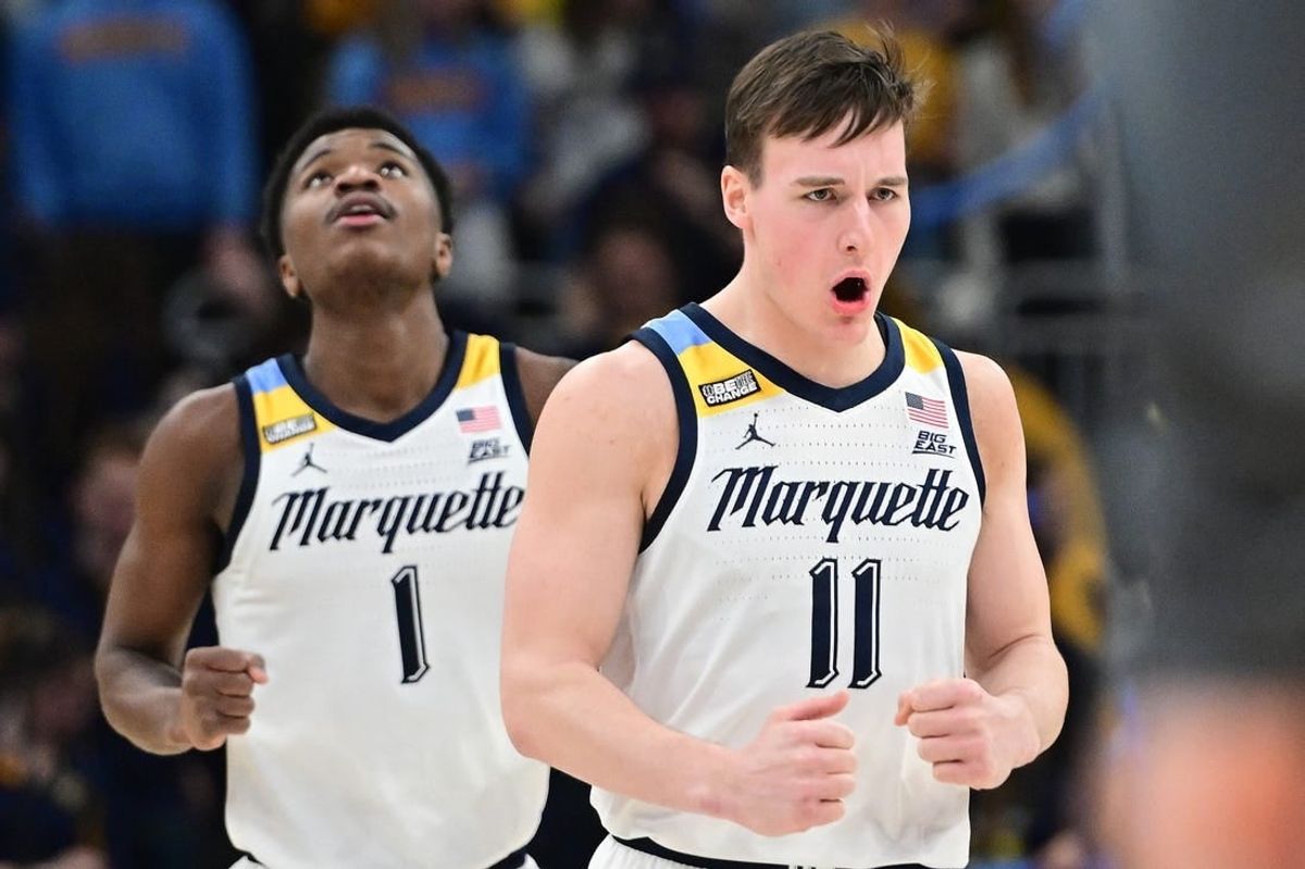 Jan 15, 2024; Milwaukee, Wisconsin, USA; Marquette Golden Eagles guard Tyler Kolek (11) reacts after scoring a basket in the second half against the Villanova Wildcats at Fiserv Forum.