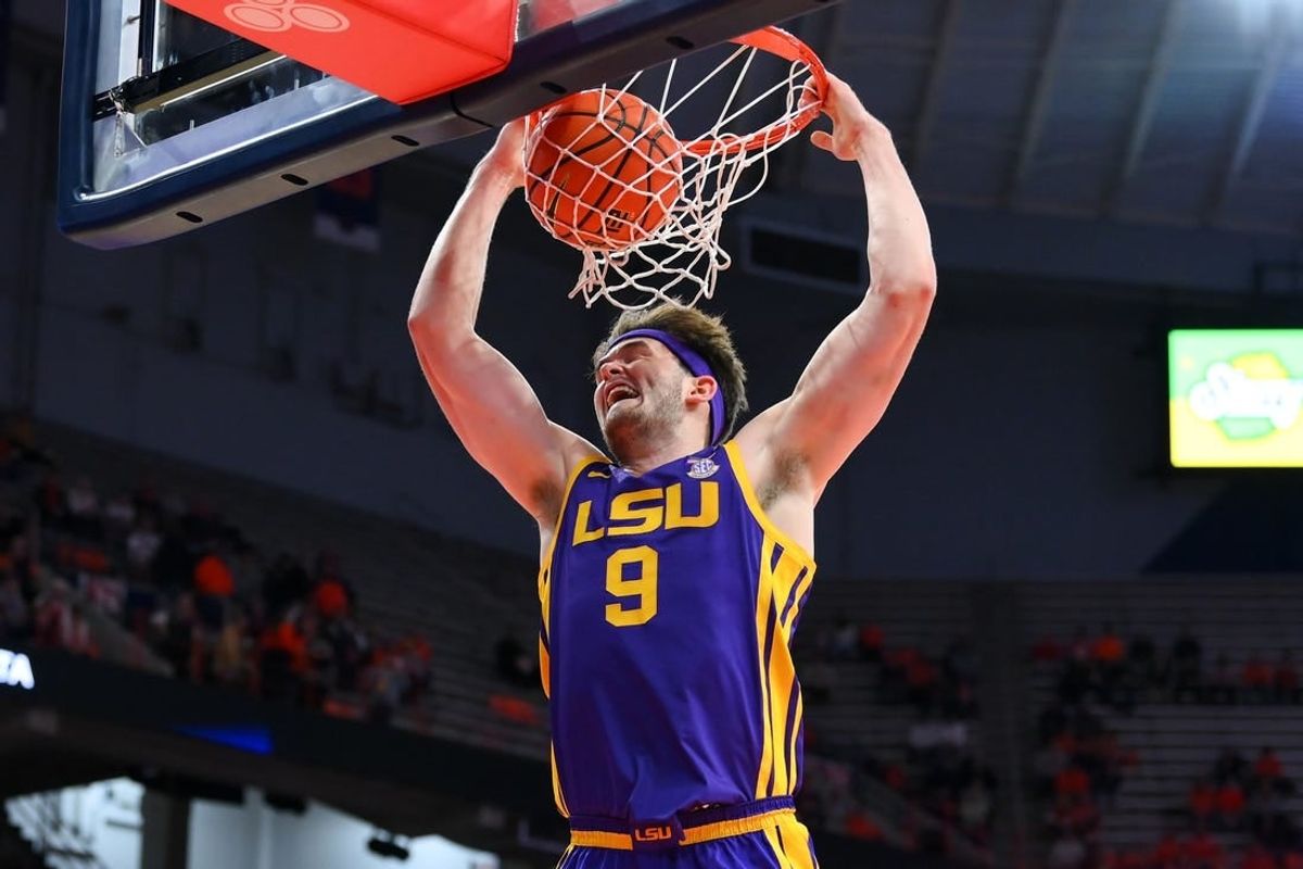 Nov 28, 2023; Syracuse, New York, USA; LSU Tigers forward Will Baker (9) dunks the ball against the Syracuse Orange during the first half at the JMA Wireless Dome.