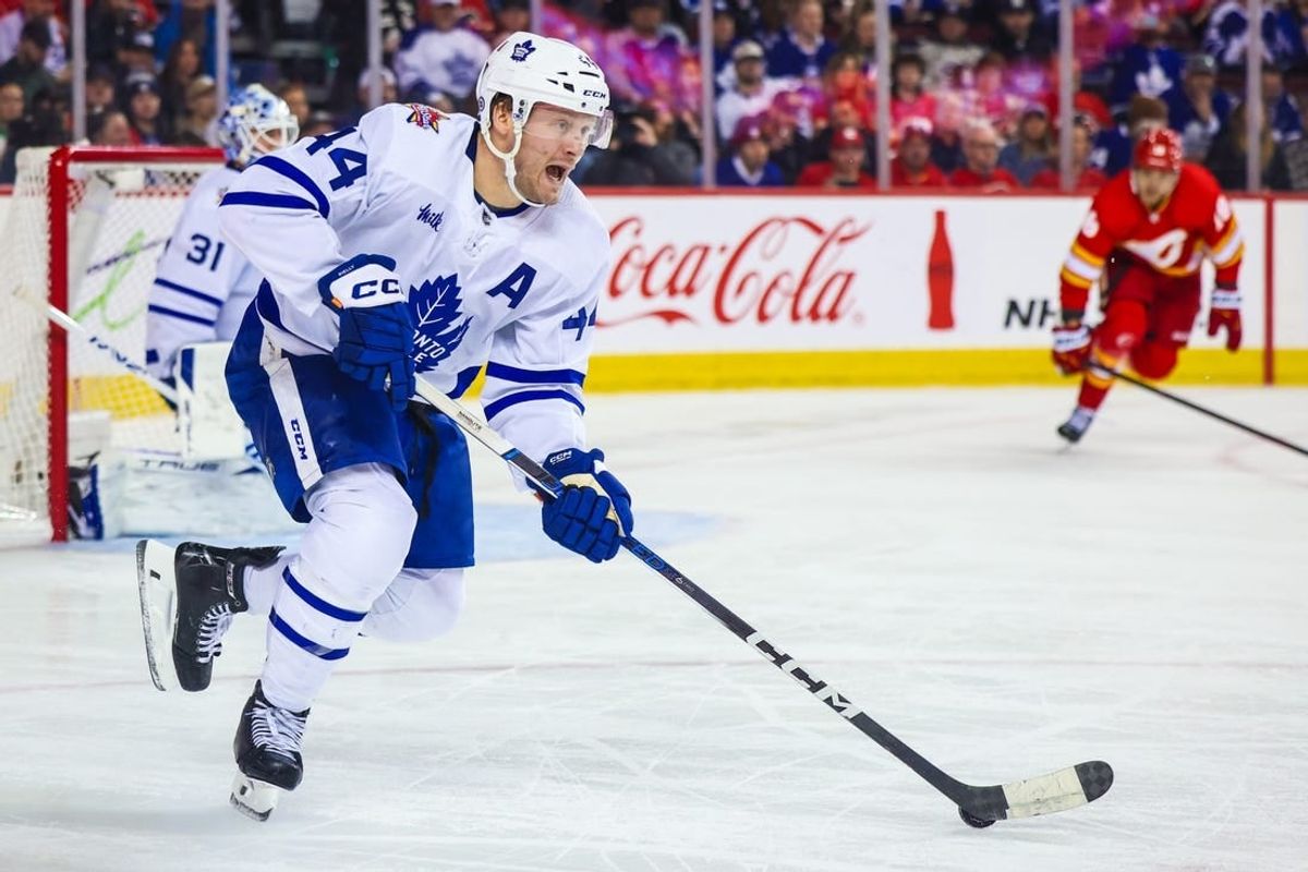 Jan 18, 2024; Calgary, Alberta, CAN; Toronto Maple Leafs defenseman Morgan Rielly (44) controls the puck against the Calgary Flames during the second period at Scotiabank Saddledome.