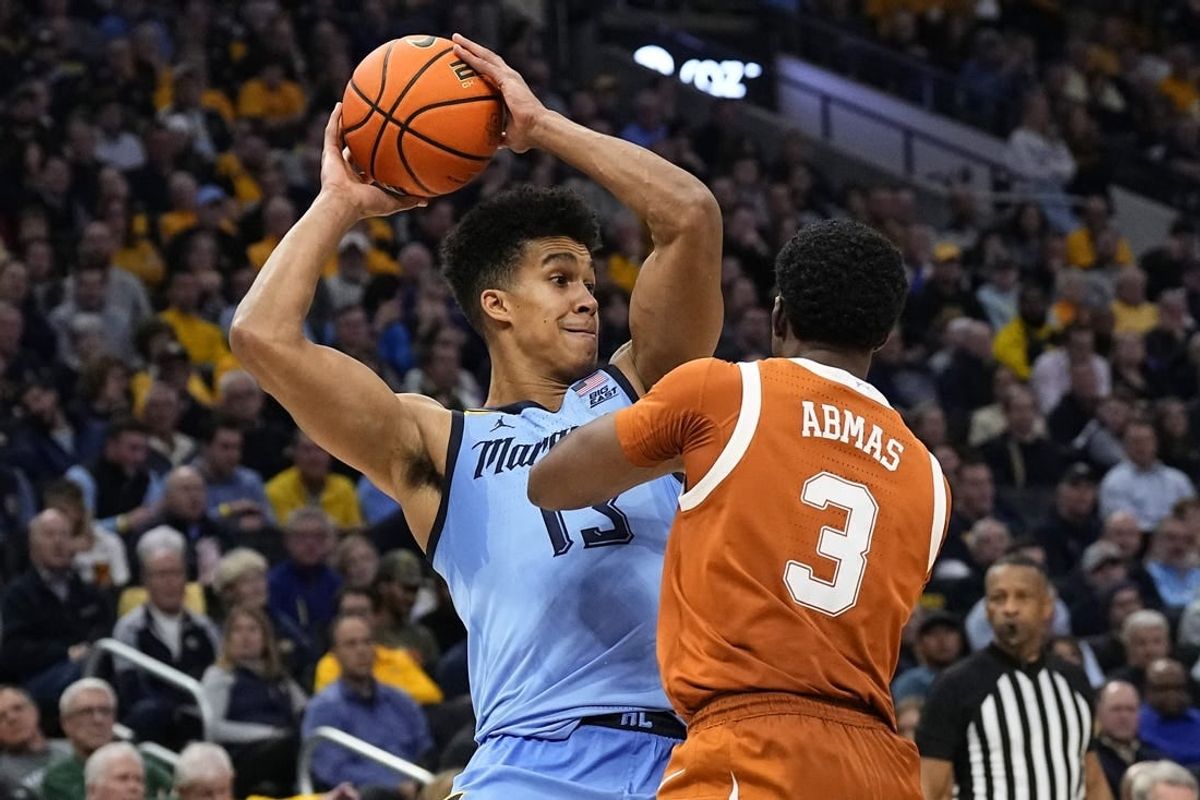 Dec 6, 2023; Milwaukee, Wisconsin, USA;  Marquette Golden Eagles forward Oso Ighodaro (13) during the game against the Texas Longhorns at Fiserv Forum.