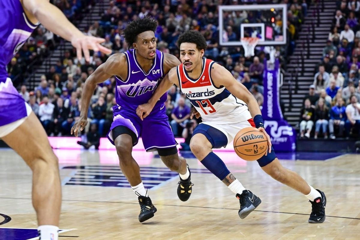Mar 4, 2024; Salt Lake City, Utah, USA; Washington Wizards guard Jordan Poole (13) drives around Utah Jazz guard Collin Sexton (2) during the first half at the Delta Center.