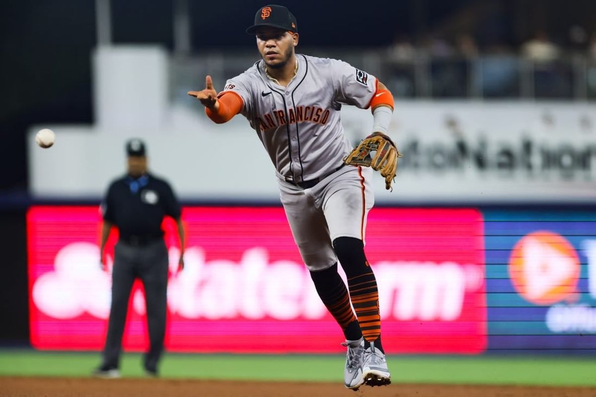 Apr 17, 2024; Miami, Florida, USA; San Francisco Giants second baseman Thairo Estrada (39) tosses the ball to first baseman Wilmer Flores (not pictured) and retires Miami Marlins second base Luis Arraez (not pictured) during the third inning at loanDepot Park.