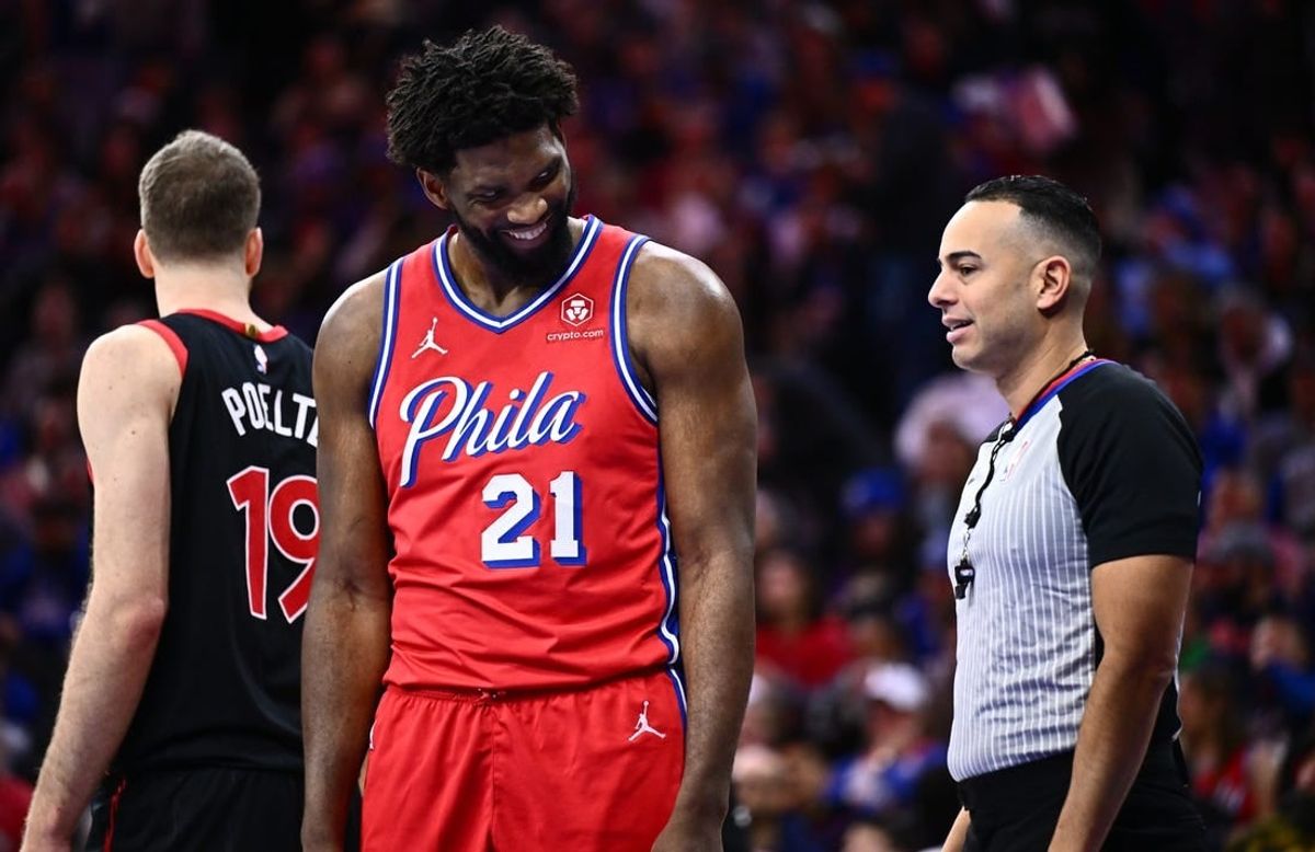 Dec 22, 2023; Philadelphia, Pennsylvania, USA; Philadelphia 76ers center Joel Embiid (21) reacts against the Toronto Raptors in the third quarter at Wells Fargo Center.