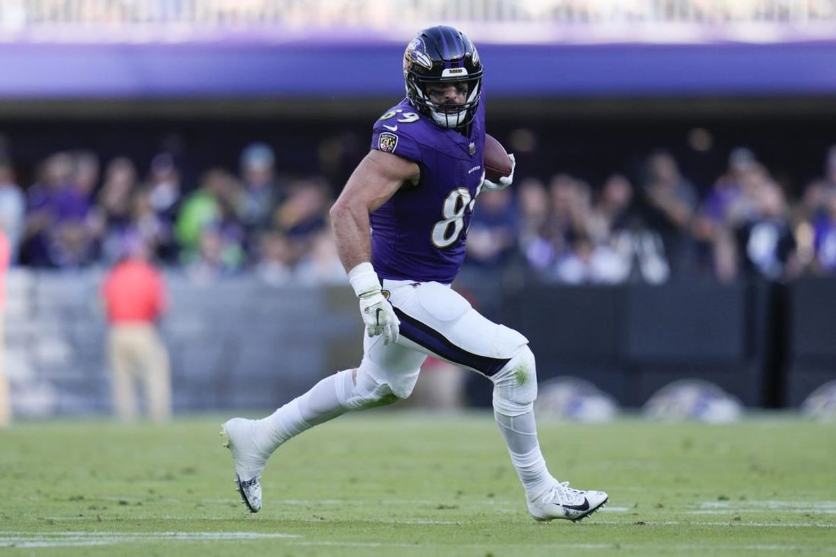 Nov 5, 2023; Baltimore, Maryland, USA;  Baltimore Ravens tight end Mark Andrews (89) runs with the ball against the Seattle Seahawks during the third quarter at M&T Bank Stadium.