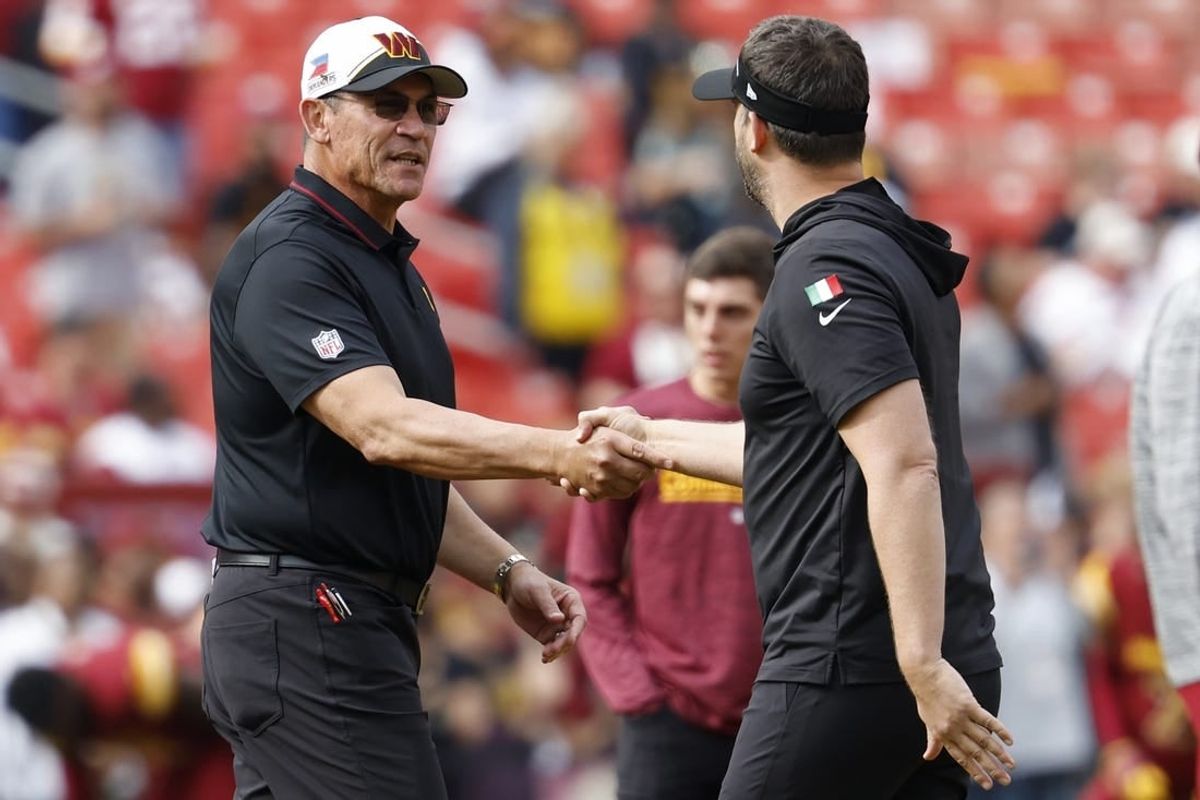 Oct 29, 2023; Landover, Maryland, USA; Washington Commanders head coach Ron Rivera (L) shakes hands with Philadelphia Eagles head coach Nick Sirianni (R) during warmup prior to their game at FedExField.
