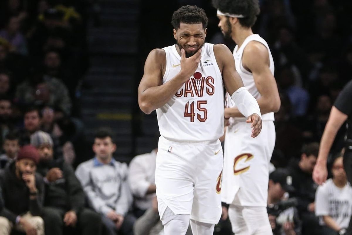 Feb 8, 2024; Brooklyn, New York, USA; Cleveland Cavaliers guard Donovan Mitchell (45) reacts after getting hit in the face in the fourth quarter against the Brooklyn Nets at Barclays Center.