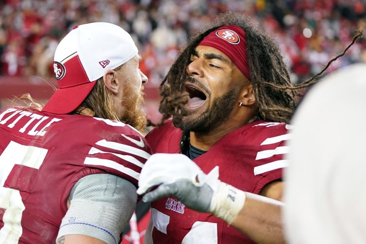January 20, 2024; Santa Clara, CA, USA; San Francisco 49ers tight end George Kittle (85) and linebacker Fred Warner (54) celebrate after defeating the Green Bay Packers in a 2024 NFC divisional round game at Levi's Stadium.