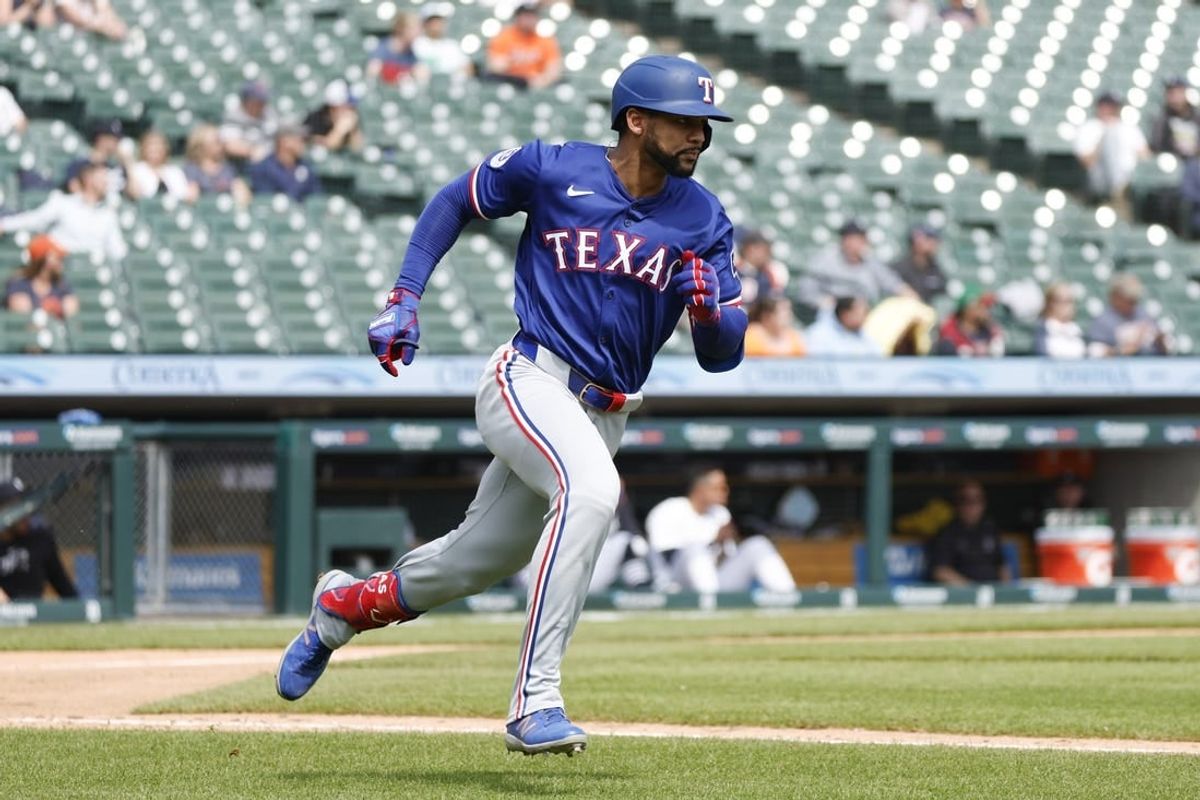 Apr 17, 2024; Detroit, Michigan, USA; Texas Rangers outfielder Leody Taveras (3) hits a single in the seventh inning against the Detroit Tigers at Comerica Park.