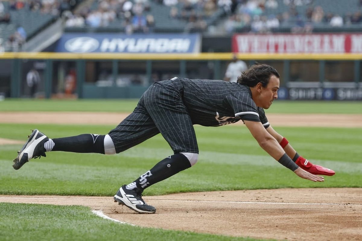 Apr 29, 2024; Chicago, Illinois, USA; Chicago White Sox second baseman Nicky Lopez (8) slides to score against the Minnesota Twins during the first inning at Guaranteed Rate Field.