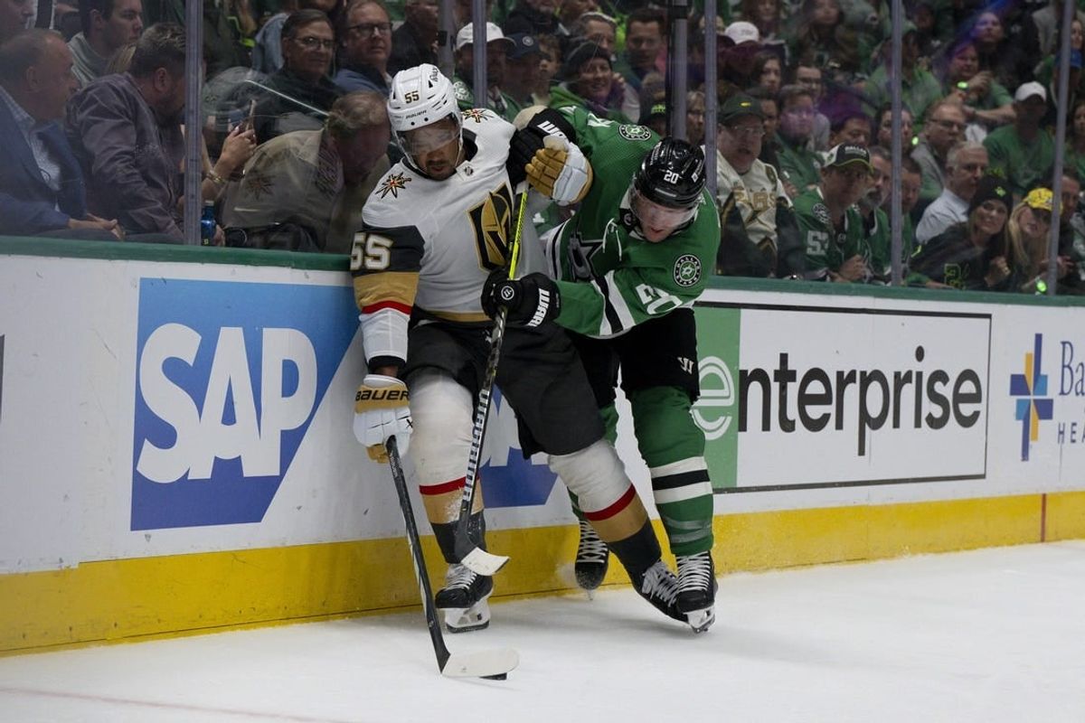 Apr 24, 2024; Dallas, Texas, USA; Vegas Golden Knights right wing Keegan Kolesar (55) and Dallas Stars defenseman Ryan Suter (20) chase the puck in the first period in game two of the first round of the 2024 Stanley Cup Playoffs at American Airlines Center.