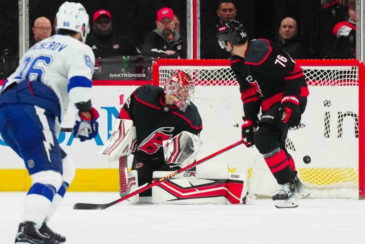 Nov 24, 2023; Raleigh, North Carolina, USA; Carolina Hurricanes goaltender Antti Raanta (32) watches Tampa Bay Lightning center Brayden Point (21) (not shown) goal during the third period at PNC Arena.