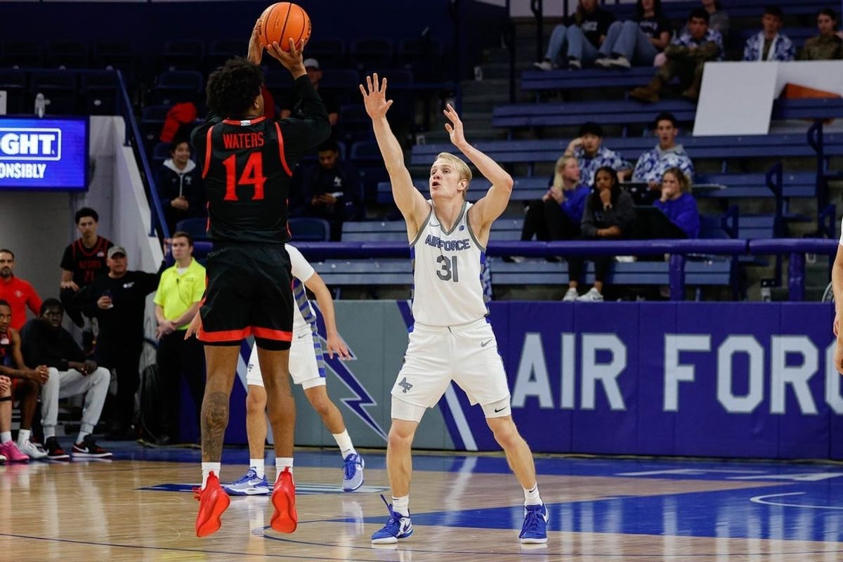 Feb 6, 2024; Colorado Springs, Colorado, USA; San Diego State Aztecs guard Reese Waters (14) attempts a shot as Air Force Falcons forward Rytis Petraitis (31) defends in the second half at Clune Arena.