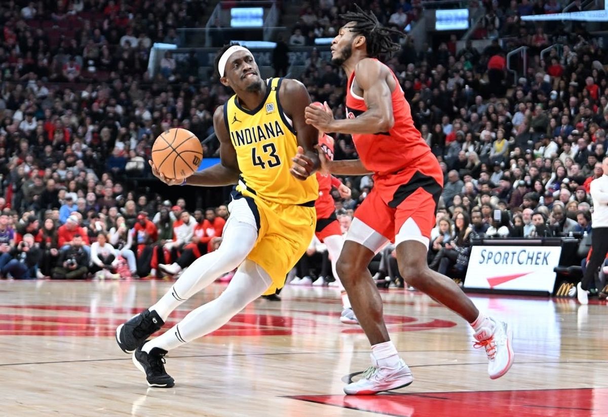 Feb 14, 2024; Toronto, Ontario, CAN;  Indiana Pacers forward Pascal Siakam (43) drives to the basket against Toronto Raptors guard Immanuel Quickley (5) in the first half at Scotiabank Arena.
