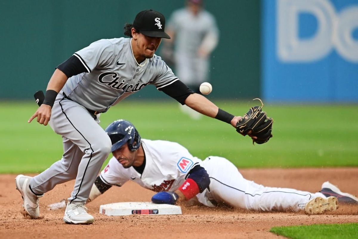 Apr 9, 2024; Cleveland, Ohio, USA; Cleveland Guardians right fielder Ramon Laureano (10) steals second as Chicago White Sox second baseman Lenyn Sosa (50) can not catch the ball from catcher Martin Maldonado (not pictured) during the fourth inning at Progressive Field.