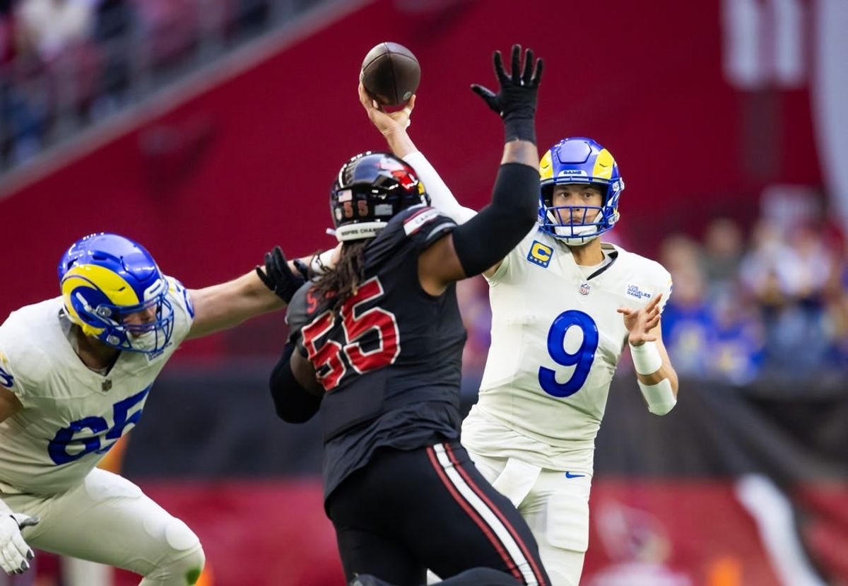Nov 26, 2023; Glendale, Arizona, USA; Los Angeles Rams quarterback Matthew Stafford (9) throws a pass against the Arizona Cardinals in the first half at State Farm Stadium.