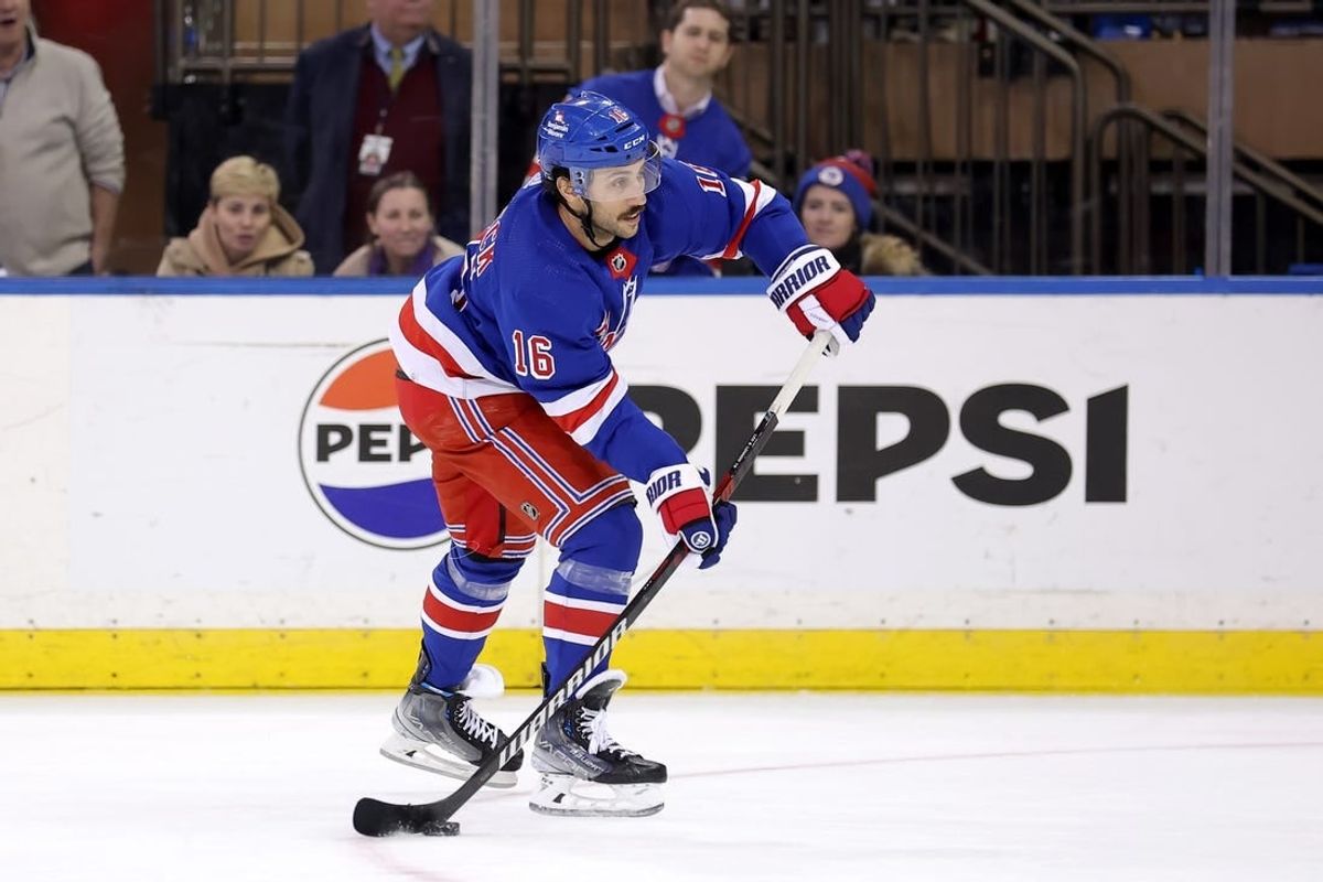 Mar 11, 2024; New York, New York, USA; New York Rangers center Vincent Trocheck (16) shoots and scores an empty net goal against the New Jersey Devils during the third period at Madison Square Garden.