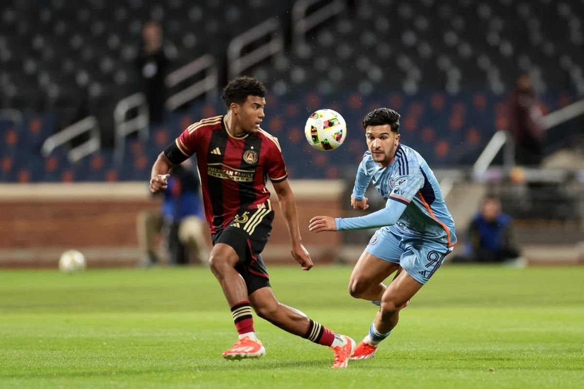 Apr 6, 2024; New York, New York, USA; New York Red Bulls midfielder Lewis Morgan (9) kicks the ball aroundAtlanta United defender Caleb Wiley (26) during the second half at CityField.