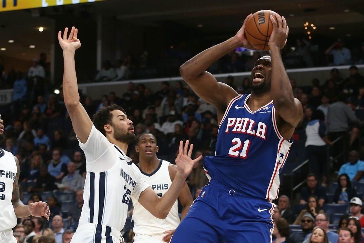 Apr 6, 2024; Memphis, Tennessee, USA; Philadelphia 76ers center Joel Embiid (21) shoots as Memphis Grizzlies forward Maozinha Pereira (25) defends during the first half at FedExForum.