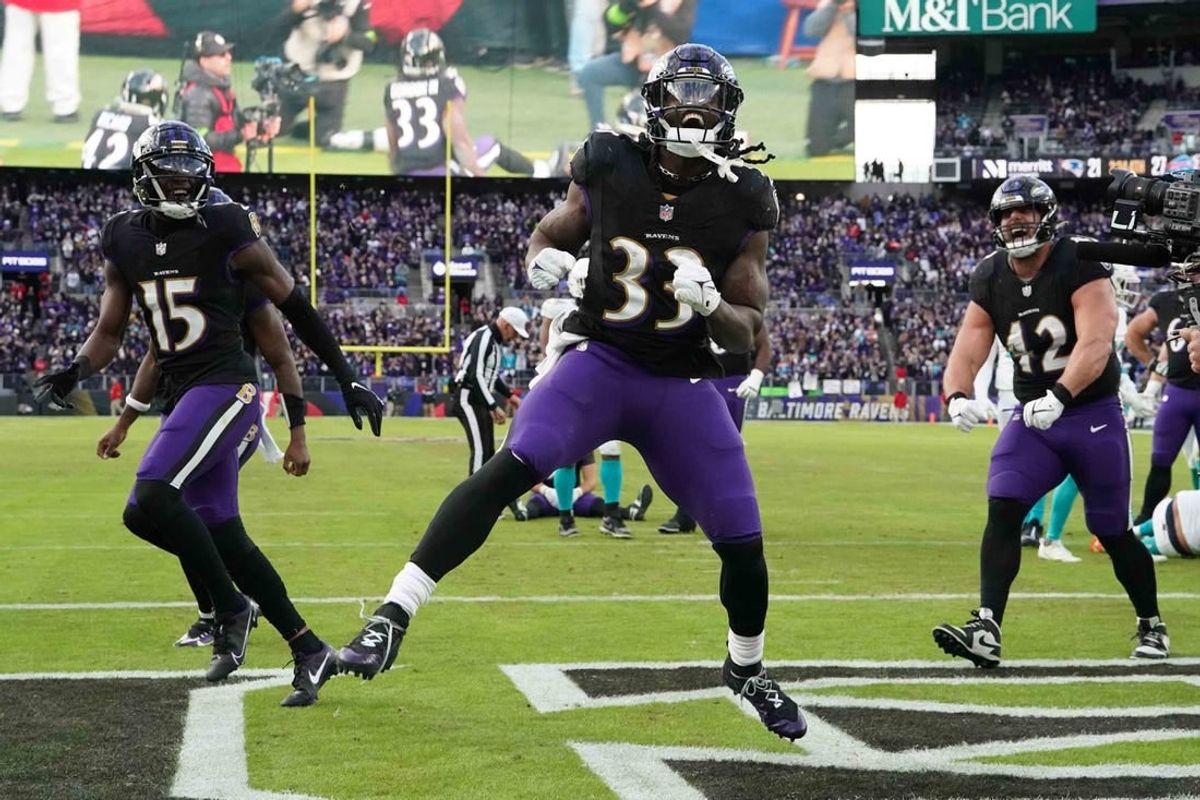 Dec 31, 2023; Baltimore, Maryland, USA; Baltimore Ravens running back Melvin Gordon III (33) reacts following his fourth quarter touchdown run against the Miami Dolphins at M&T Bank Stadium.