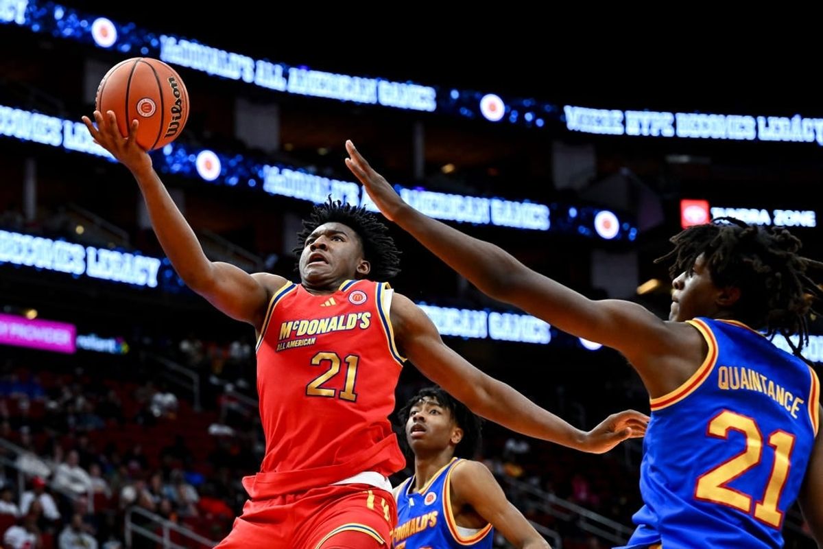 Apr 2, 2024; Houston, TX, USA; McDonald's All American West guard Karter Knox (21) shoots around McDonald's All American East forward Jayden Quaintance (21) during the second half at Toyota Center.